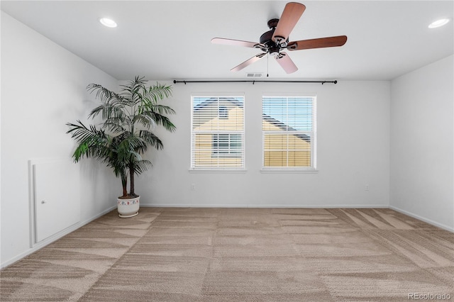 spare room with recessed lighting, visible vents, carpet floors, and baseboards