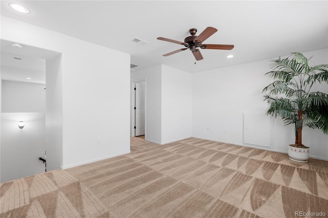 spare room with visible vents, baseboards, ceiling fan, light colored carpet, and recessed lighting