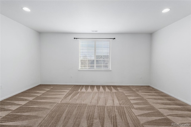 unfurnished room with recessed lighting, baseboards, and carpet floors