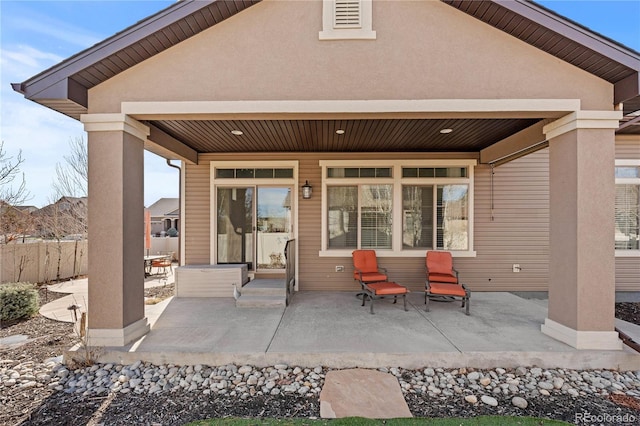 view of patio / terrace featuring fence