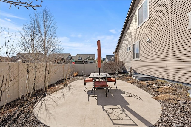view of patio featuring outdoor dining area and a fenced backyard