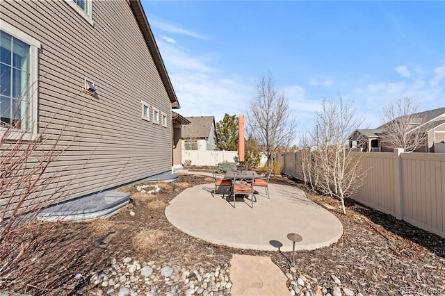 view of yard featuring a patio area and a fenced backyard