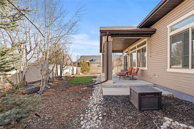 view of yard featuring a patio area and a fenced backyard