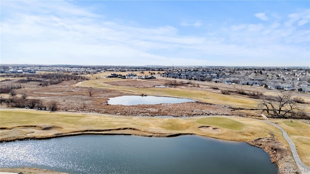 aerial view featuring golf course view and a water view