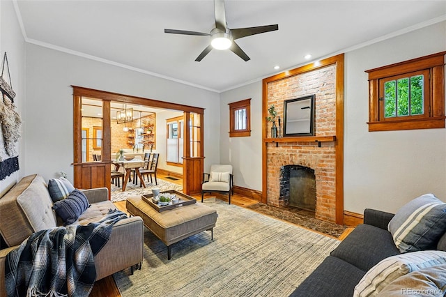 3928 Zuni St, Denver, CO 80211 - living area with a chandelier, wood finished floors, baseboards, a fireplace, and ceiling fan