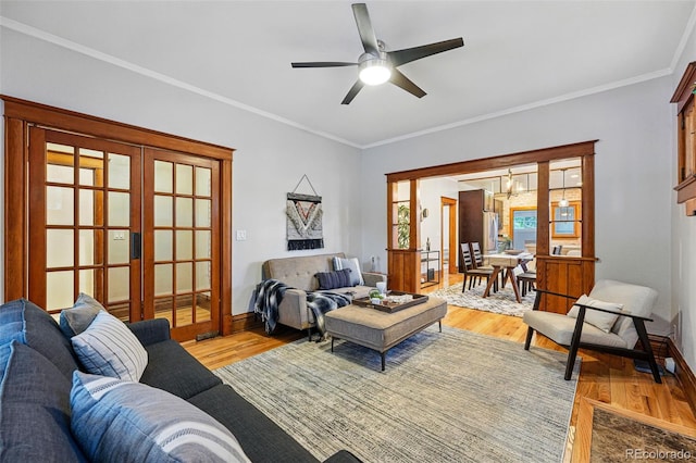 3928 Zuni St, Denver, CO 80211 - living area with french doors, light wood finished floors, a ceiling fan, ornamental molding, and baseboards