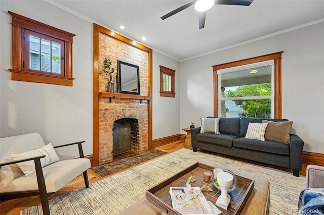 3928 Zuni St, Denver, CO 80211 - living area with wood finished floors, a ceiling fan, a fireplace, crown molding, and baseboards