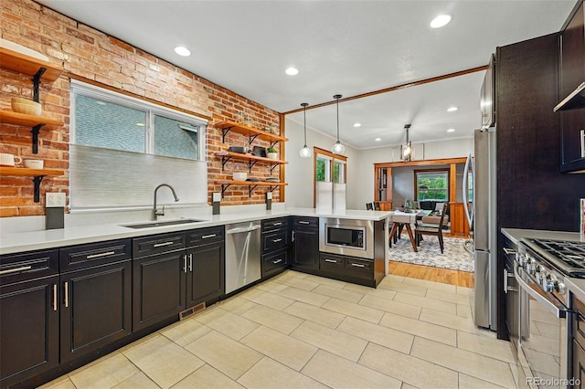 3928 Zuni St, Denver, CO 80211 - kitchen with appliances with stainless steel finishes, a sink, open shelves, dark cabinetry, and crown molding