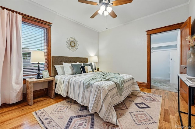 3928 Zuni St, Denver, CO 80211 - bedroom with crown molding, light wood-style floors, a ceiling fan, and baseboards