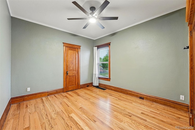 3928 Zuni St, Denver, CO 80211 - spare room featuring light wood-type flooring, baseboards, ceiling fan, and crown molding