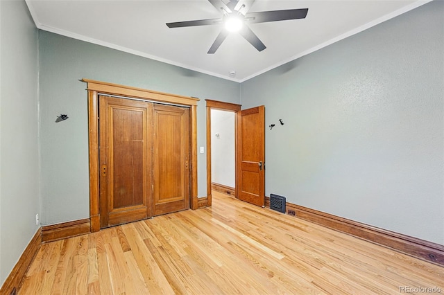 3928 Zuni St, Denver, CO 80211 - unfurnished bedroom featuring light wood-style floors, baseboards, crown molding, and ceiling fan