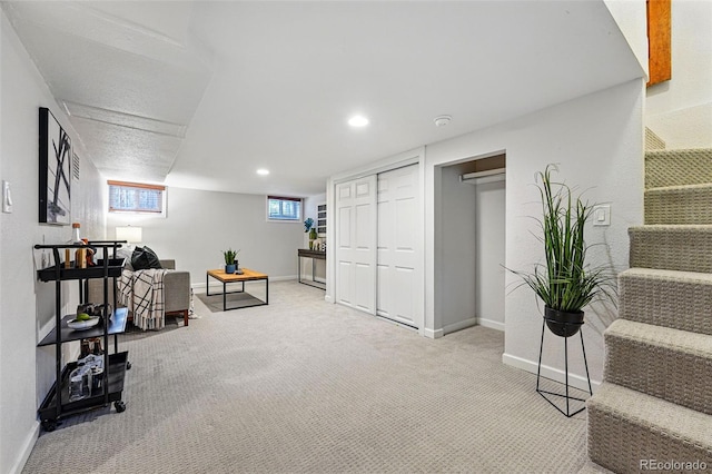 3928 Zuni St, Denver, CO 80211 - living area featuring carpet flooring, baseboards, and recessed lighting