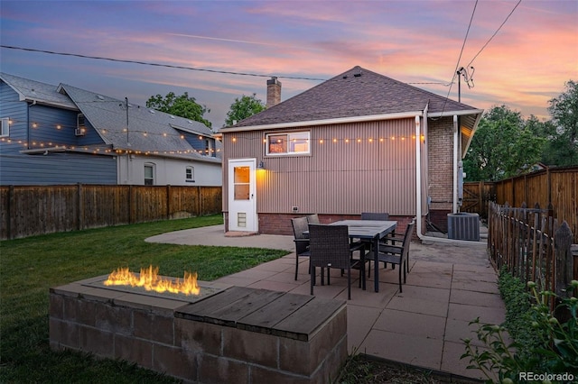 3928 Zuni St, Denver, CO 80211 - patio terrace at dusk with a fire pit and central air condition unit