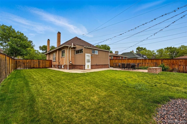 3928 Zuni St, Denver, CO 80211 - back of house featuring a chimney, a patio, and brick siding