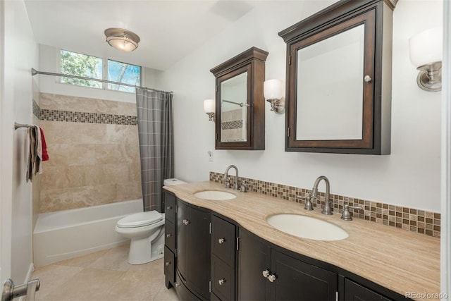 bathroom featuring double vanity, shower / bath combo, toilet, tile patterned floors, and tasteful backsplash