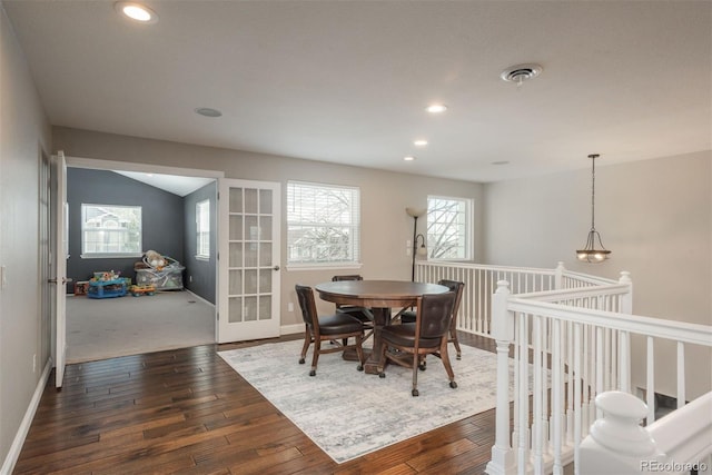 dining area with dark wood finished floors, recessed lighting, baseboards, and french doors