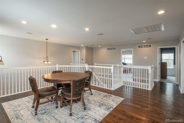 dining room with hardwood / wood-style floors and recessed lighting