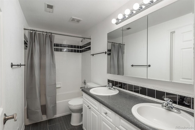 full bath featuring toilet, shower / bathtub combination with curtain, and double vanity