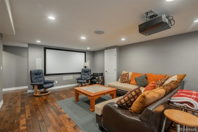home theater room featuring hardwood / wood-style floors, baseboards, and recessed lighting