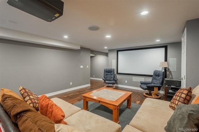 cinema featuring wood finished floors, recessed lighting, and baseboards