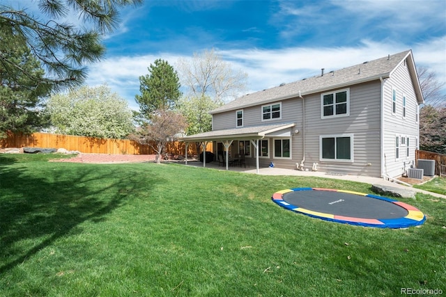 rear view of house with a patio and central AC unit