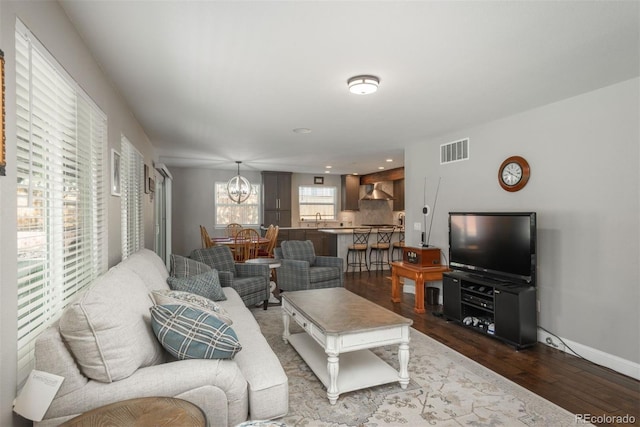 9325 Lark Sparrow Dr, Highlands Ranch, CO 80126 - living room with dark wood-style flooring and recessed lighting