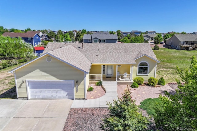 12454 Tex Tan Rd, Peyton, CO 80831 - view of front of home with covered porch, a residential view, driveway, and a garage