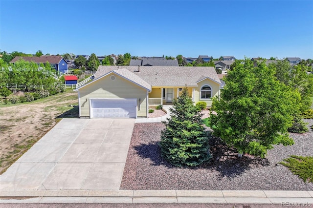 12454 Tex Tan Rd, Peyton, CO 80831 - single story home featuring an attached garage, driveway, and a residential view