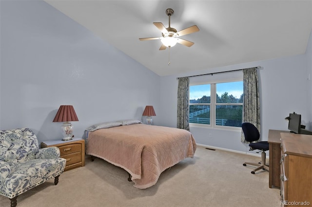 12454 Tex Tan Rd, Peyton, CO 80831 - bedroom with vaulted ceiling, light carpet, an office area, ceiling fan, and baseboards