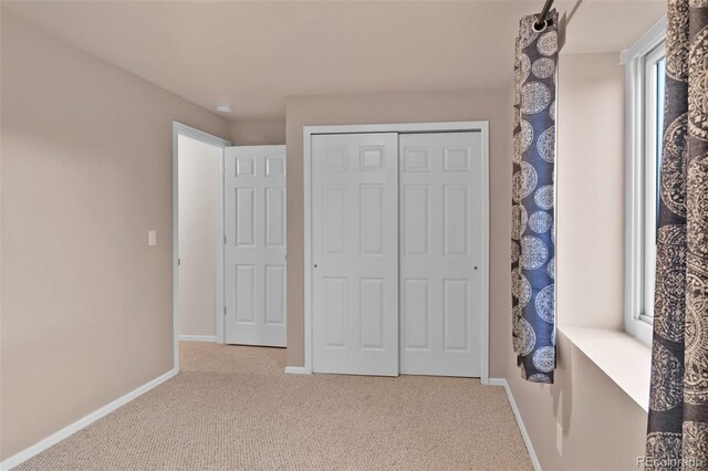 12454 Tex Tan Rd, Peyton, CO 80831 - unfurnished bedroom with carpet, baseboards, and a closet