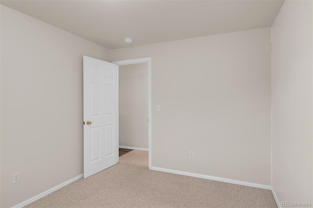 12454 Tex Tan Rd, Peyton, CO 80831 - empty room featuring carpet, baseboards, and a smoke detector