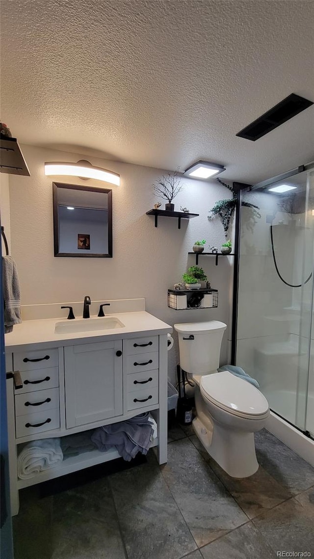4214 Widener St, Pueblo, CO 81008 - bathroom featuring vanity, a textured ceiling, toilet, and a shower stall