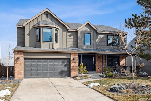 view of front of home featuring concrete driveway, brick siding, board and batten siding, and a porch