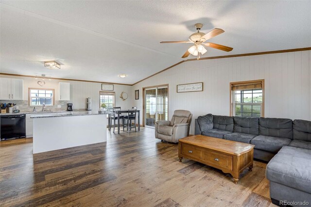 15650 W Valdez Cir, Peyton, CO 80831 - living room with wood finished floors, a ceiling fan, crown molding, and lofted ceiling