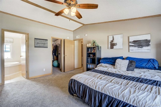 15650 W Valdez Cir, Peyton, CO 80831 - carpeted bedroom featuring ornamental molding, vaulted ceiling, a spacious closet, a closet, and ensuite bath