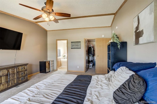 15650 W Valdez Cir, Peyton, CO 80831 - carpeted bedroom featuring lofted ceiling, a spacious closet, baseboards, a textured ceiling, and ensuite bath