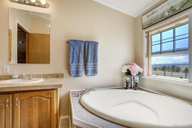 15650 W Valdez Cir, Peyton, CO 80831 - bathroom featuring crown molding, vanity, and a garden tub