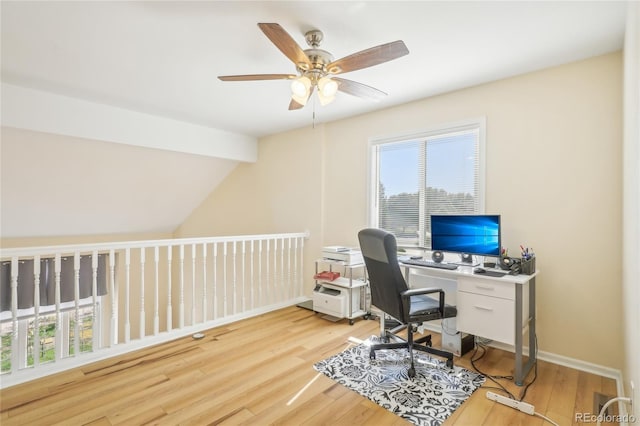 office area featuring ceiling fan, lofted ceiling, and light wood-type flooring