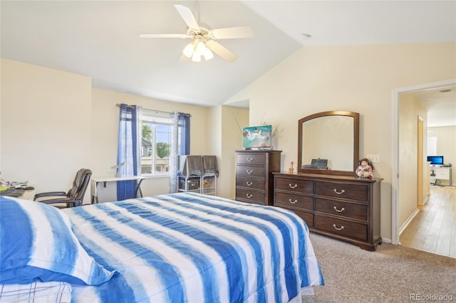 carpeted bedroom with lofted ceiling and ceiling fan