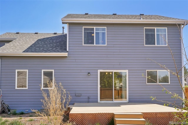 back of house featuring a deck