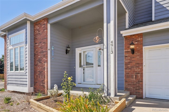 property entrance with a garage