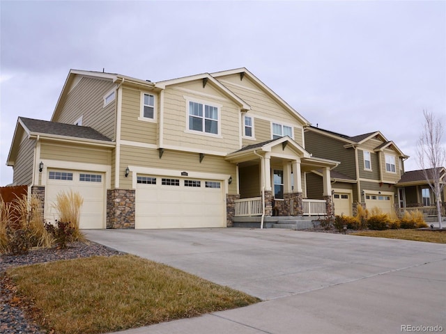 craftsman-style house featuring a garage and covered porch