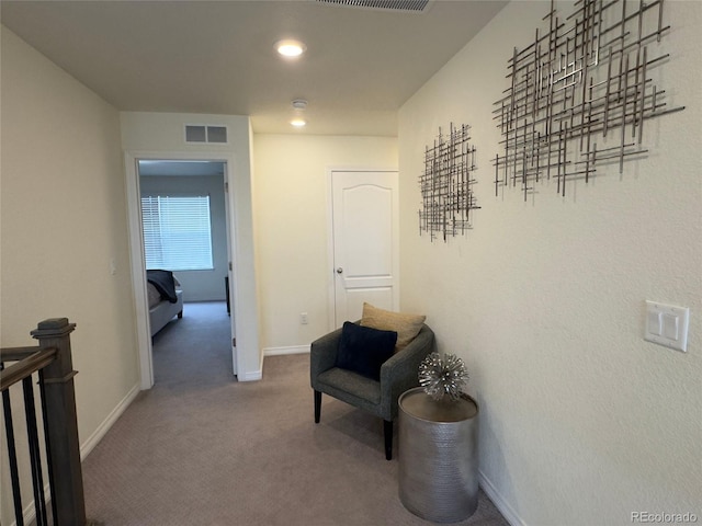 hallway with carpet flooring