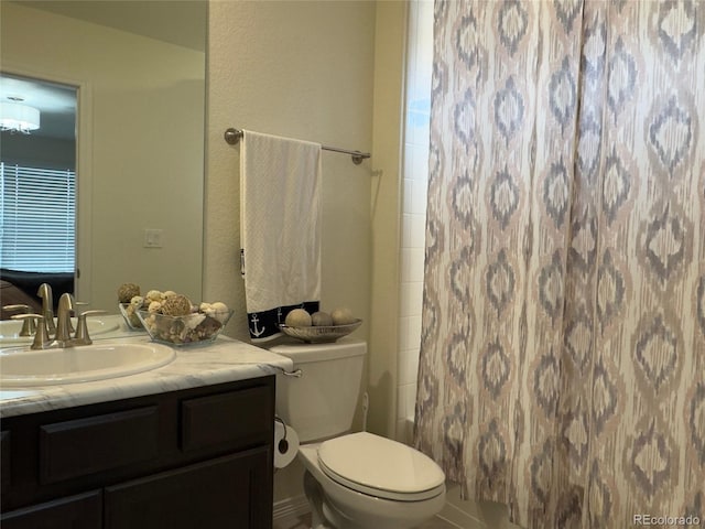 full bathroom with toilet, vanity, and shower / bath combination with curtain