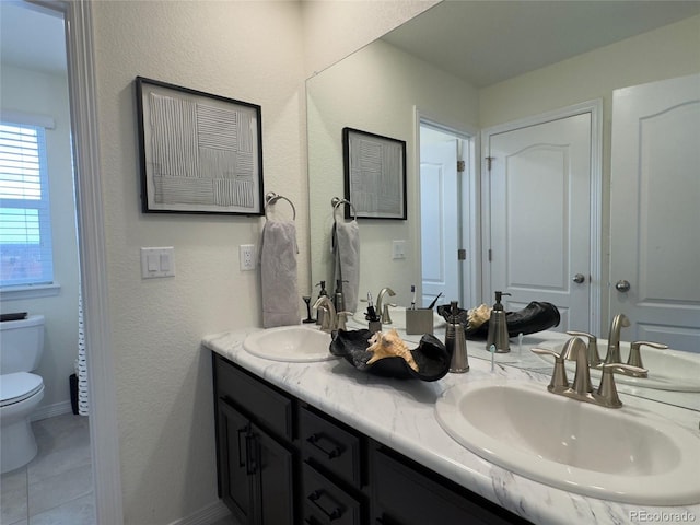 bathroom featuring vanity, toilet, and tile patterned floors