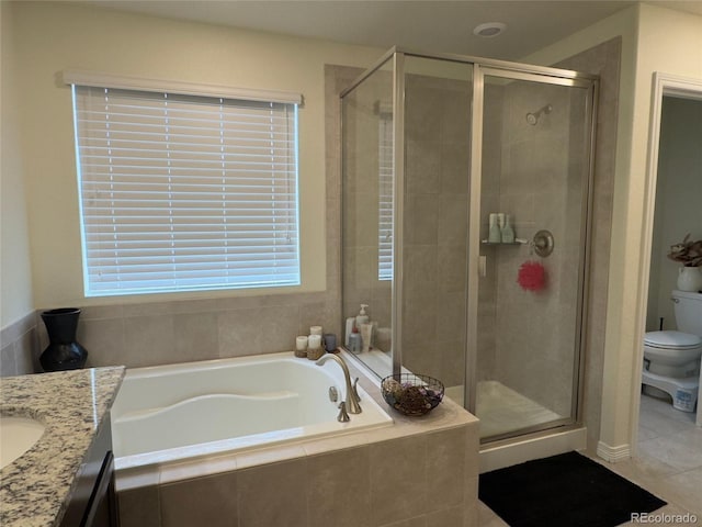 full bathroom featuring toilet, vanity, independent shower and bath, and tile patterned flooring