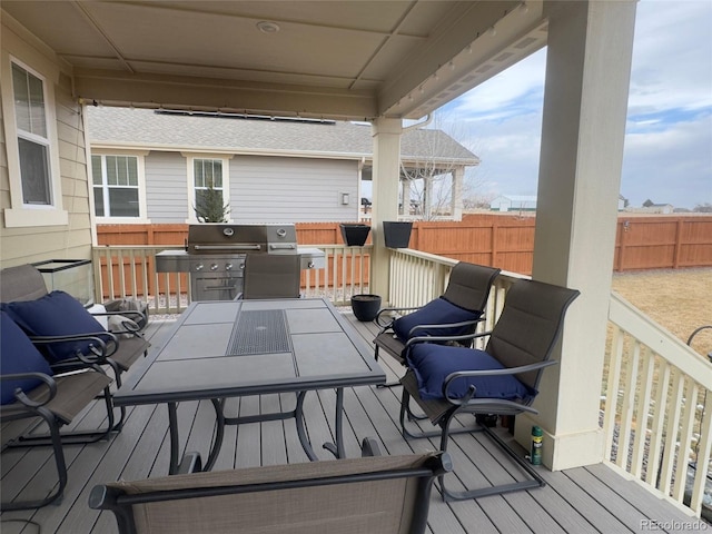 wooden deck featuring grilling area