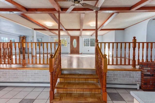 7032 County Road 156c, Salida, CO 81201 - stairs with a baseboard radiator, beam ceiling, a wealth of natural light, and ceiling fan