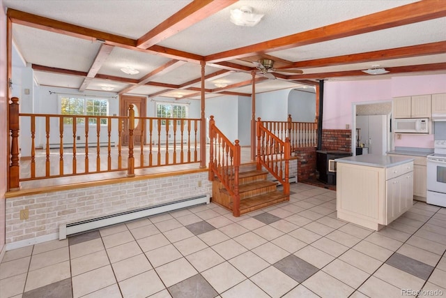 interior space featuring baseboard heating, ceiling fan, and tile patterned floors