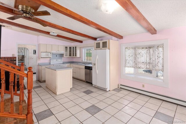 7032 County Road 156c, Salida, CO 81201 - kitchen with a baseboard heating unit, a textured ceiling, glass insert cabinets, white appliances, and a kitchen island